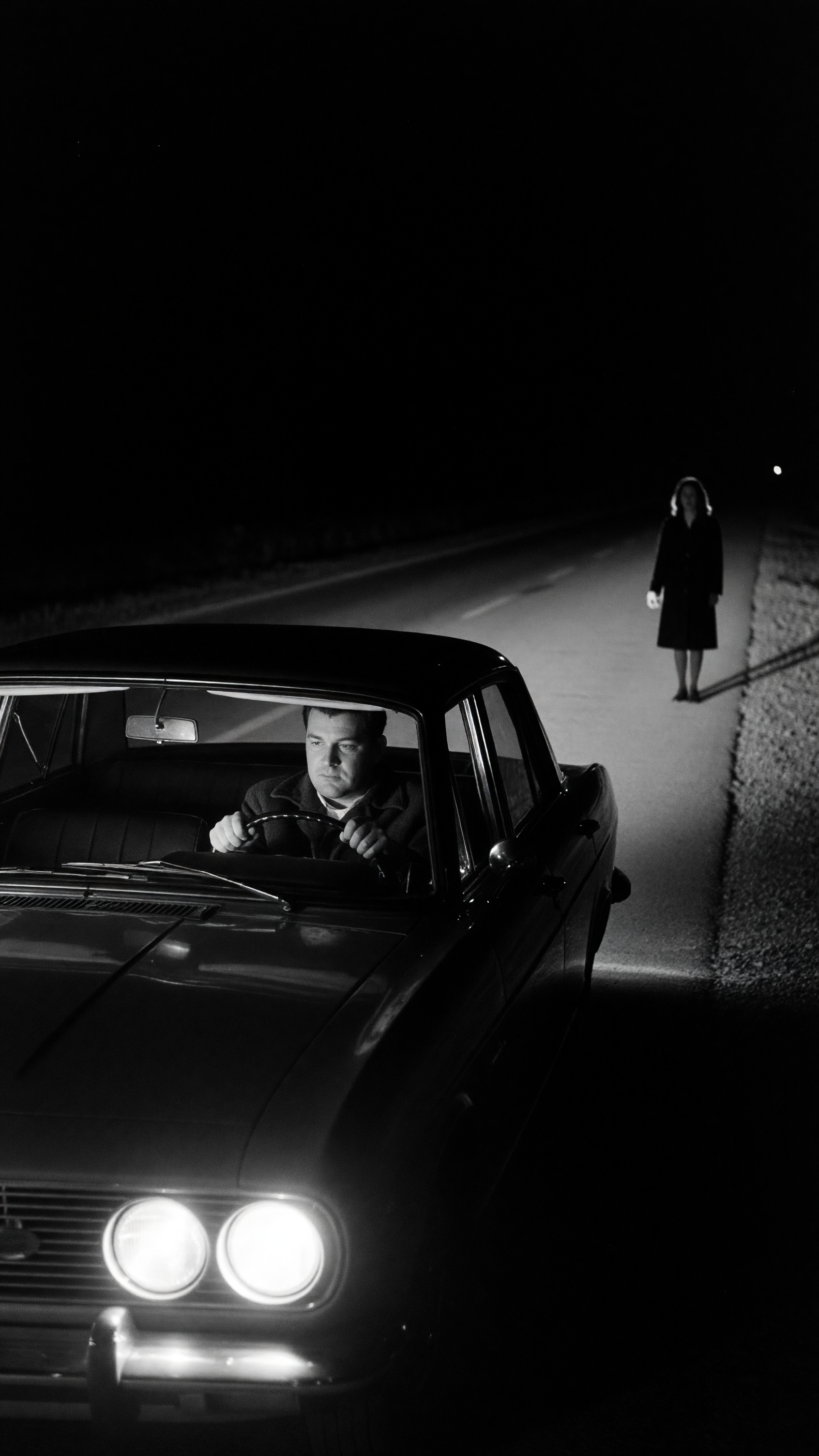 A man was driving home late one dark night when